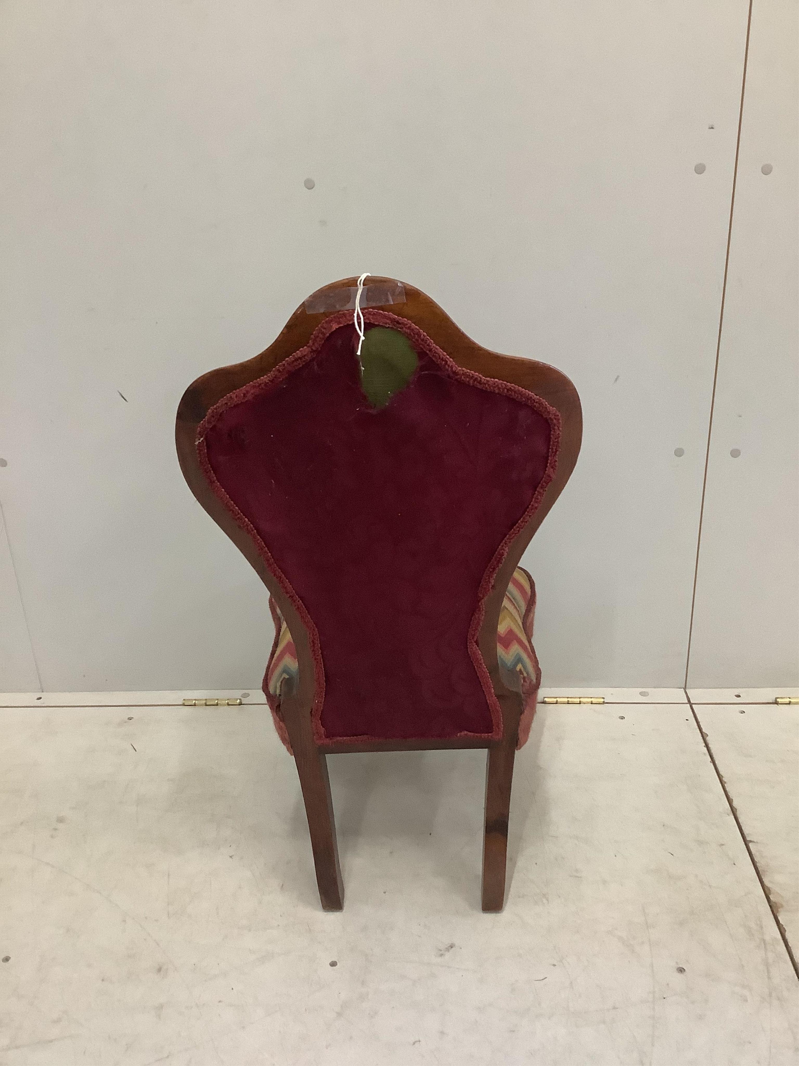 A Victorian rosewood nursing chair, width 40cm, height 87cm